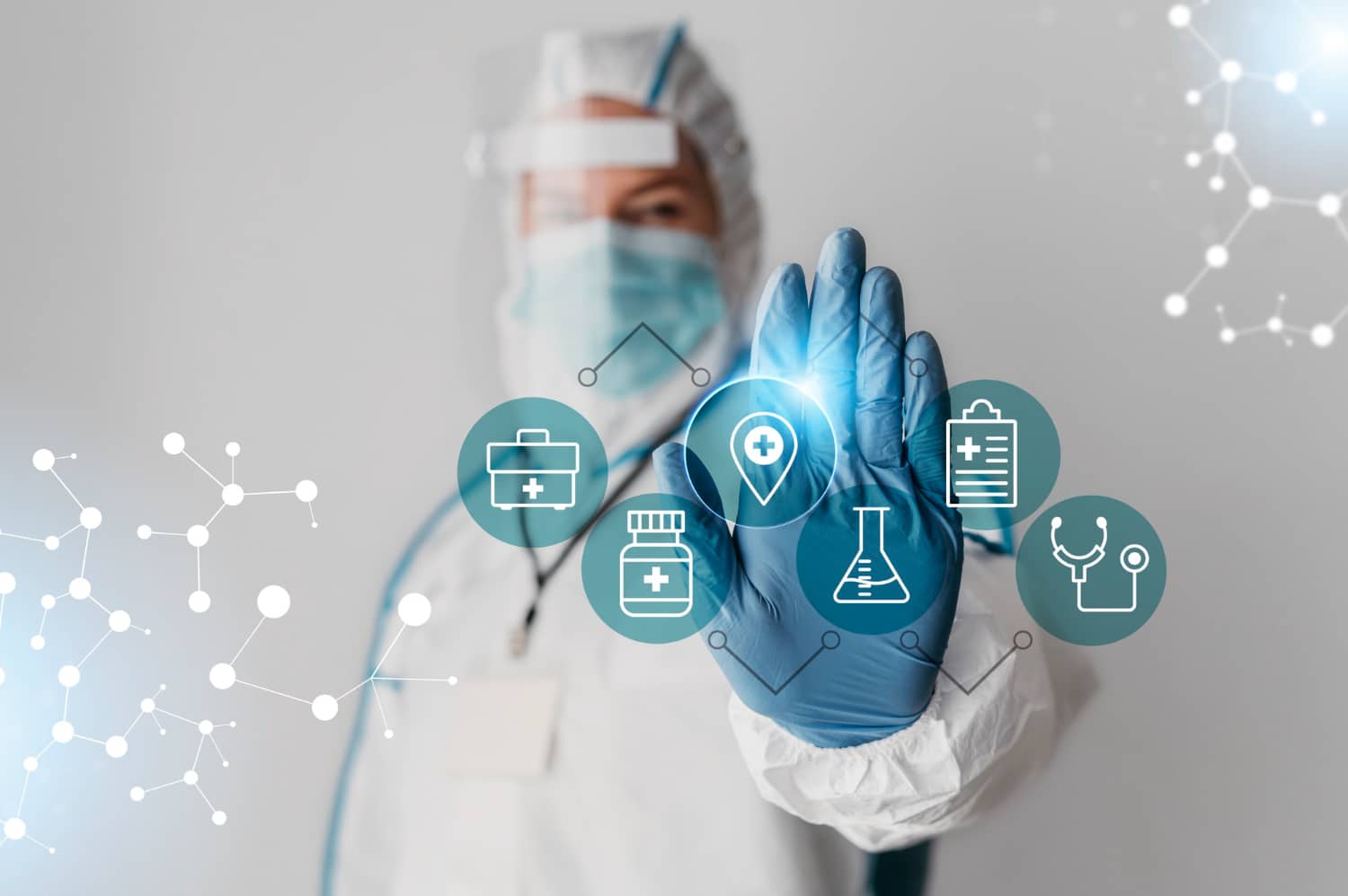 a person wearing a protective suit and gloves touching a touch screen