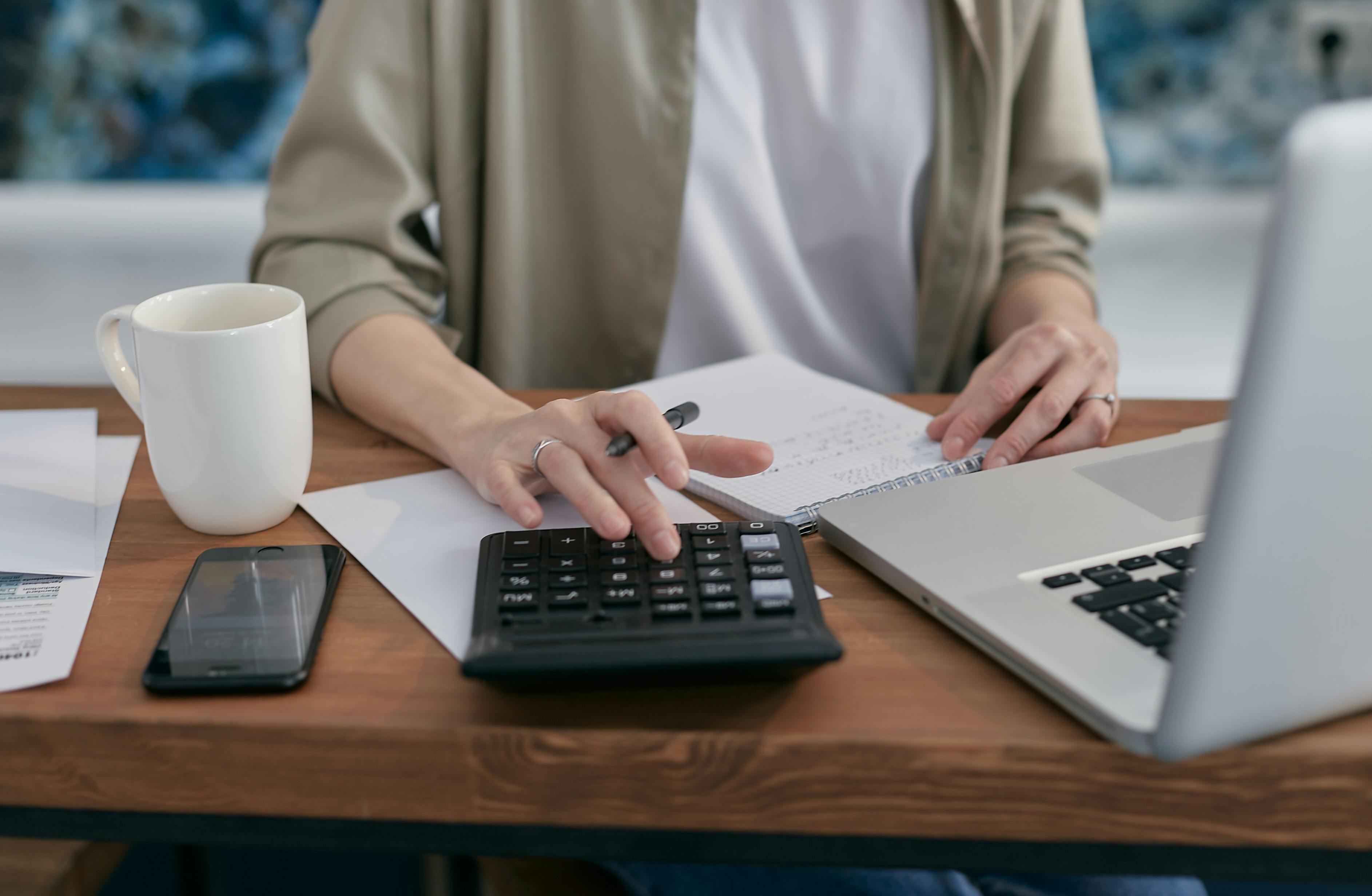 business executive working on a calculator